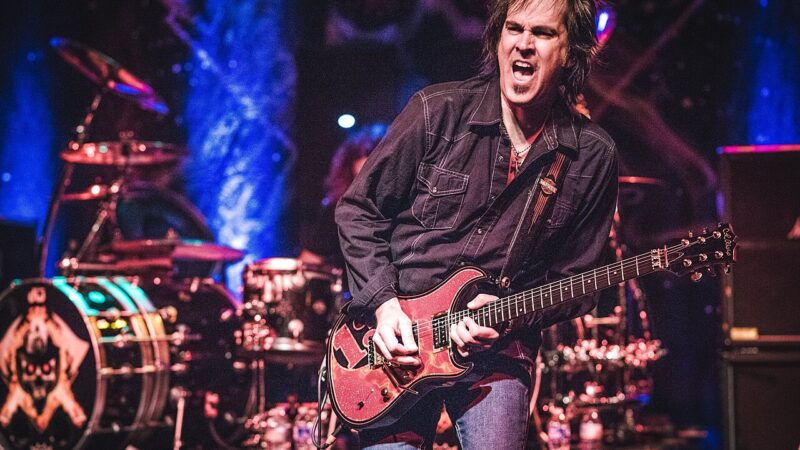 A guitarist performing on stage