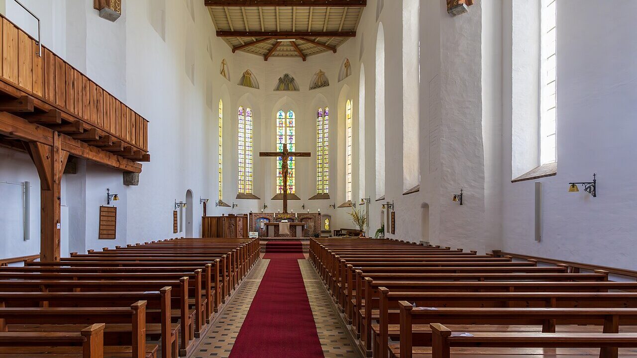 The interior of a church with rows of pews