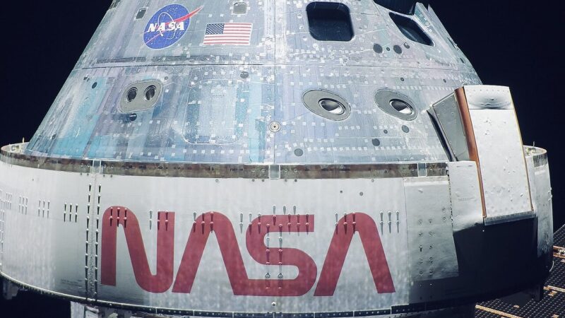 The Orion spacecraft in lunar orbit with the Moon behind it