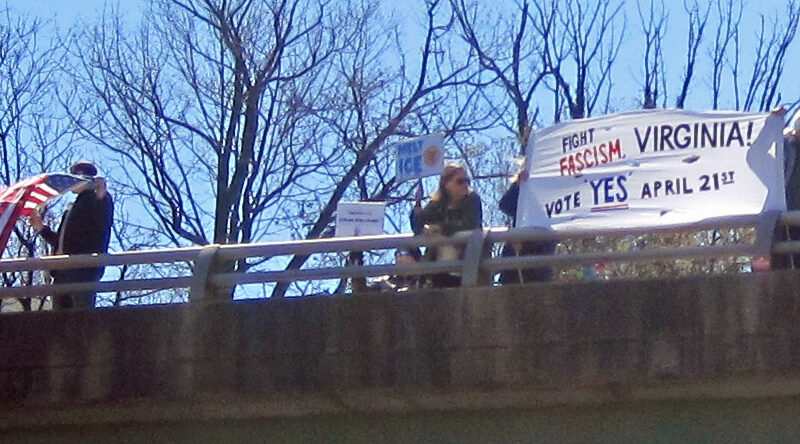 No Kings protesters with banners on a bridge in Arlington Virginia