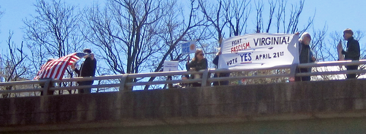 No Kings protesters with banners on a bridge in Arlington Virginia
