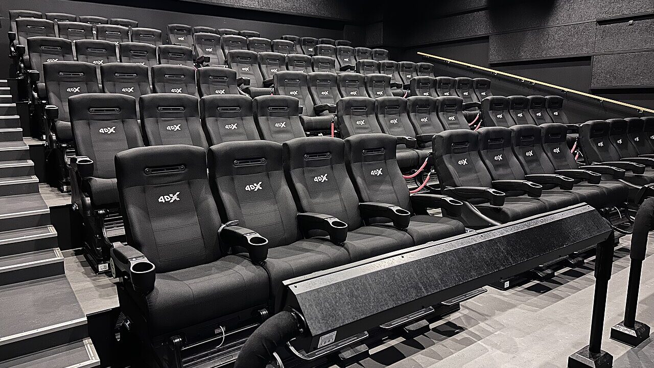 Rows of seats inside a modern 4DX cinema auditorium