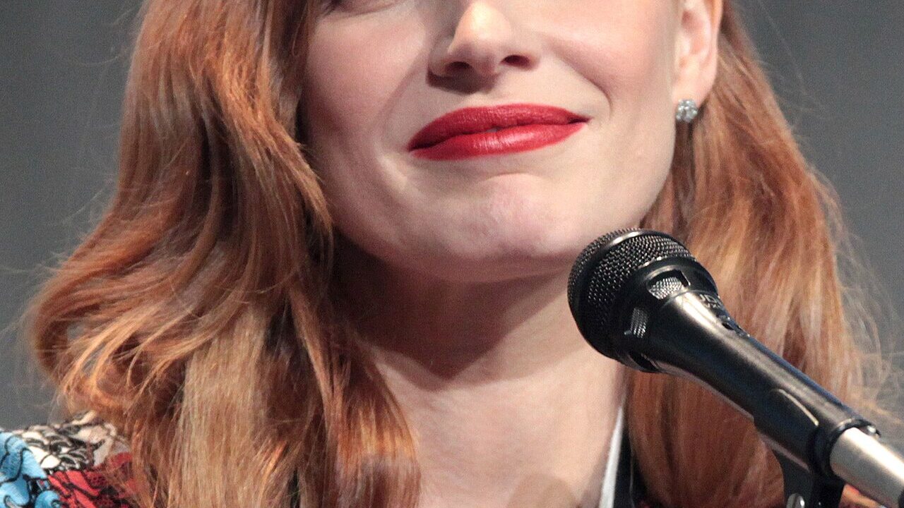 Actress Jessica Chastain speaking at a microphone