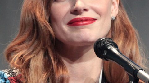 Actress Jessica Chastain speaking at a microphone