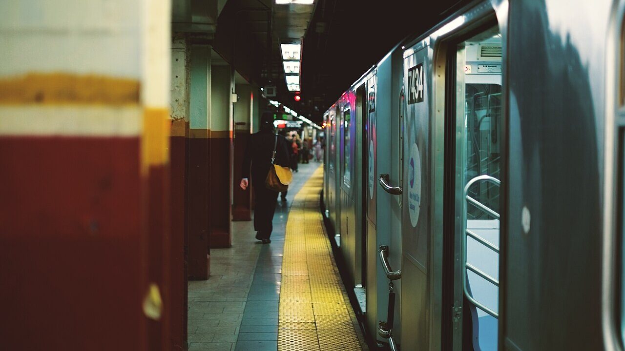 New York City subway train stopped at an underground platform