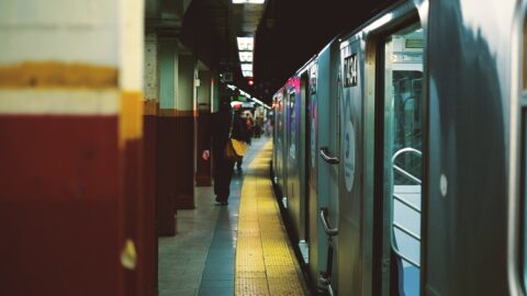 New York City subway train stopped at an underground platform