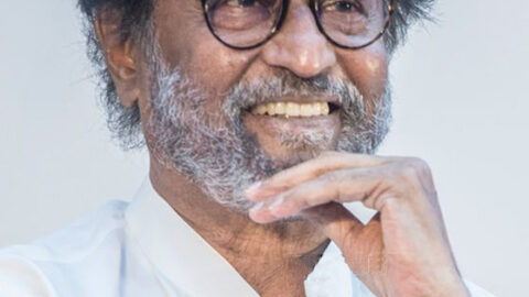 Rajinikanth smiling at a public event