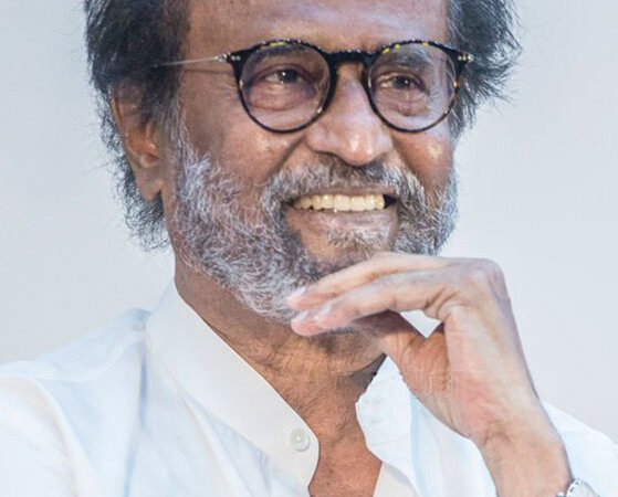 Rajinikanth smiling at a public event