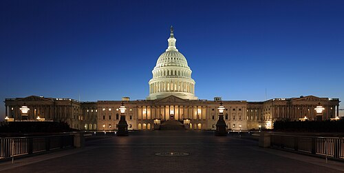 The United States Capitol illuminated at dusk in Washington